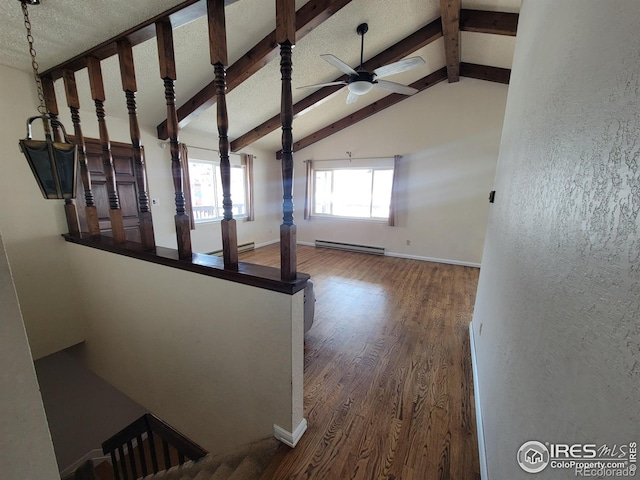 interior space featuring ceiling fan, wood-type flooring, lofted ceiling with beams, a textured ceiling, and a baseboard radiator