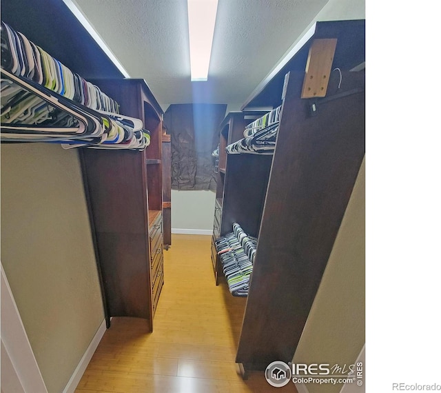 spacious closet with light wood-type flooring