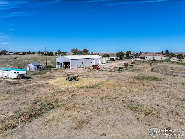 view of yard featuring an outbuilding and a rural view