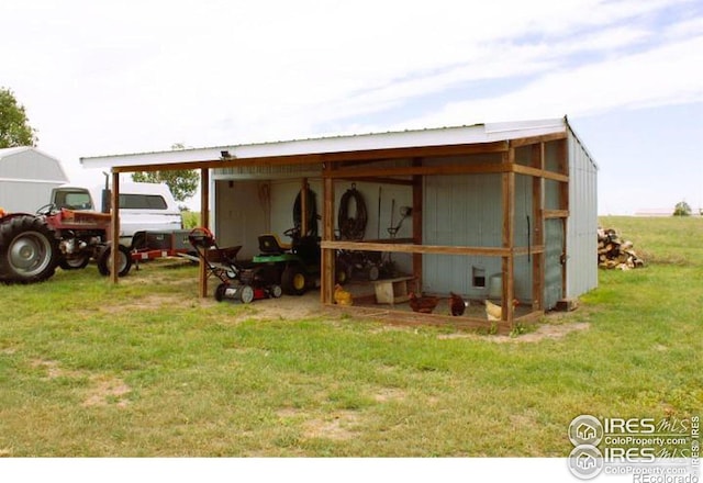 view of outbuilding with a lawn