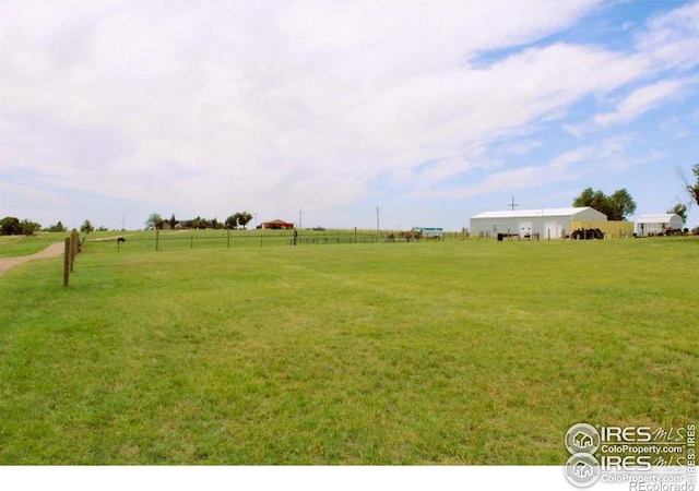 view of yard with a rural view