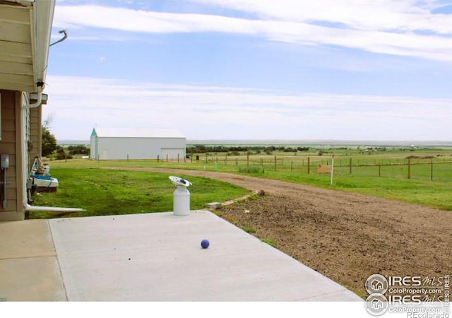 view of yard with a patio and a rural view