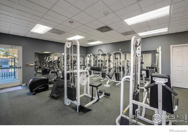 workout area featuring a drop ceiling