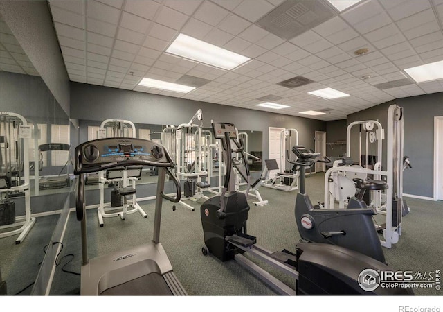 exercise room featuring a drop ceiling