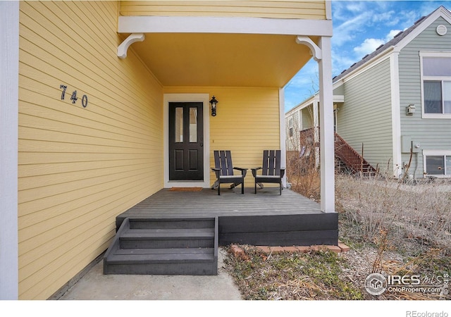 doorway to property with a deck