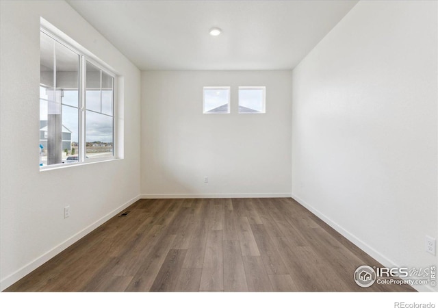 empty room featuring hardwood / wood-style floors