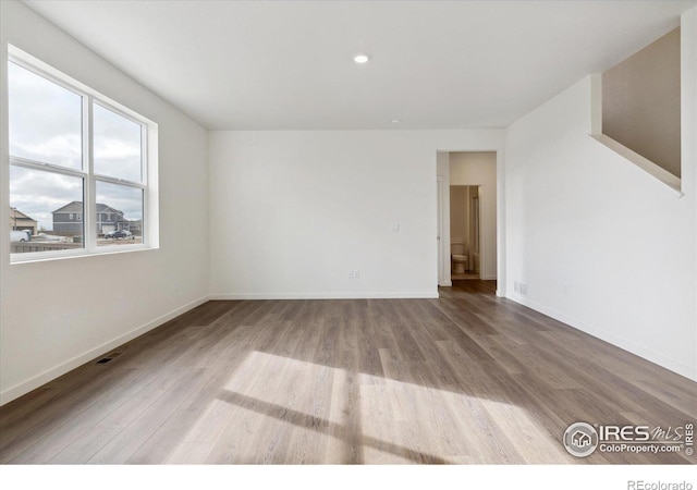 empty room featuring wood-type flooring