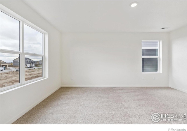 unfurnished room with carpet flooring