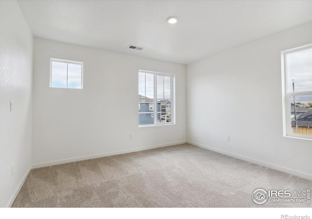 unfurnished room featuring carpet flooring