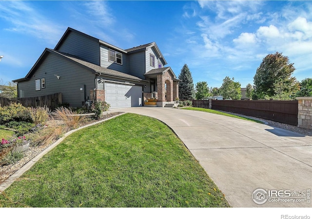 view of side of home featuring a garage and a lawn