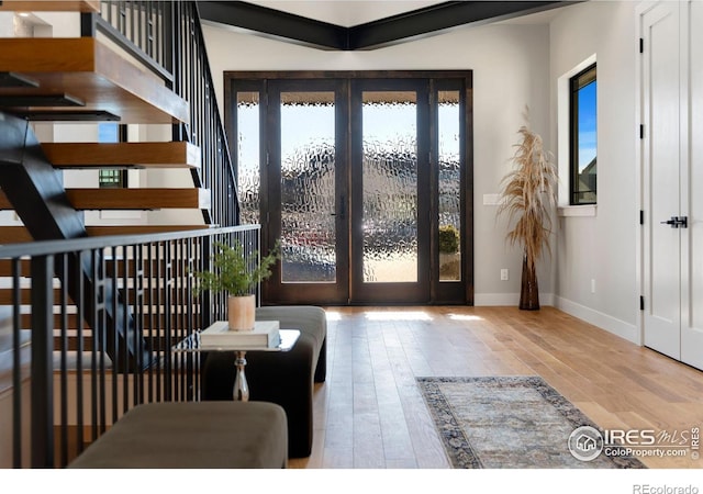 foyer entrance featuring hardwood / wood-style floors