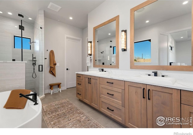 3650 Tall Grass Ct, Timnath, CO 80547 - bathroom featuring a shower stall, double vanity, recessed lighting, and a soaking tub