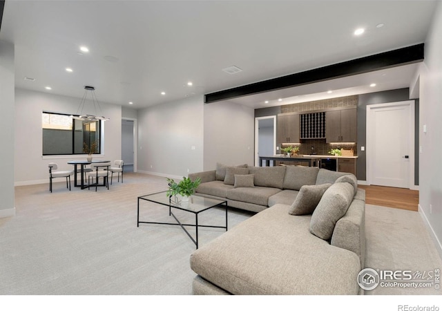 3650 Tall Grass Ct, Timnath, CO 80547 - living room with recessed lighting, baseboards, beverage cooler, and light colored carpet