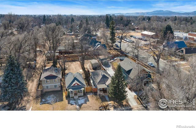 birds eye view of property featuring a mountain view and a residential view