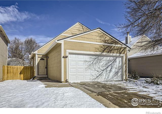 view of snow covered garage