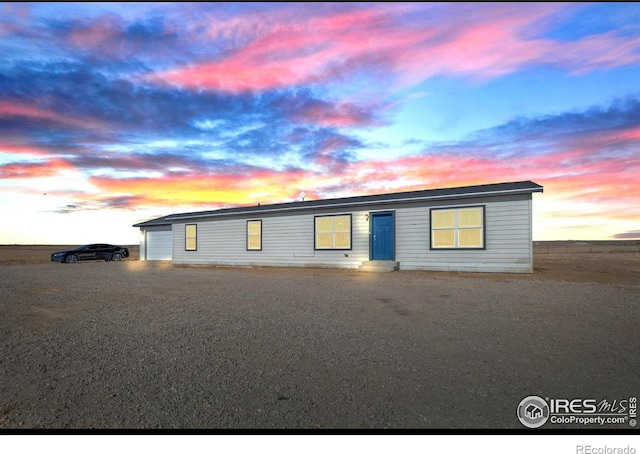 manufactured / mobile home featuring a garage