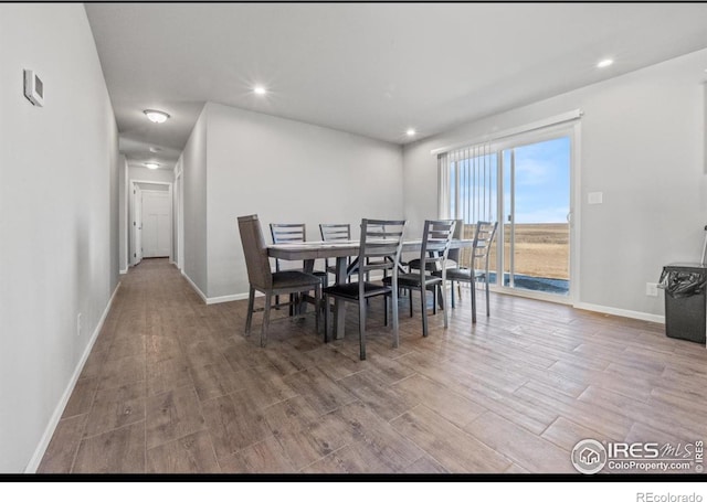 dining area with hardwood / wood-style flooring