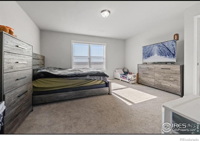 bedroom featuring light colored carpet