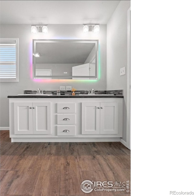 bathroom with hardwood / wood-style flooring and vanity