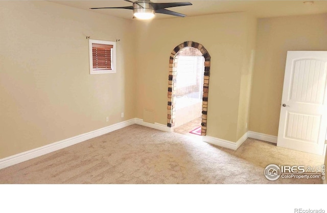 2023 81st Ave, Greeley, CO 80634 - carpeted empty room featuring a ceiling fan and arched walkways