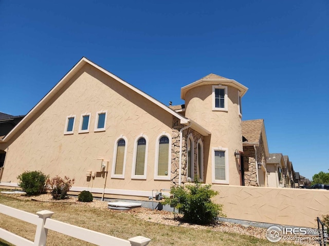 2023 81st Ave, Greeley, CO 80634 - view of side of property with stucco siding and stone siding