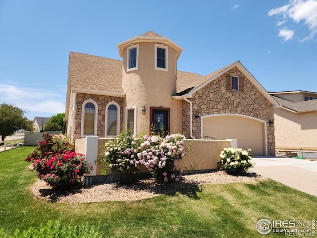 2023 81st Ave, Greeley, CO 80634 - view of front of property with stone siding, a garage, driveway, stucco siding, and a shingled roof