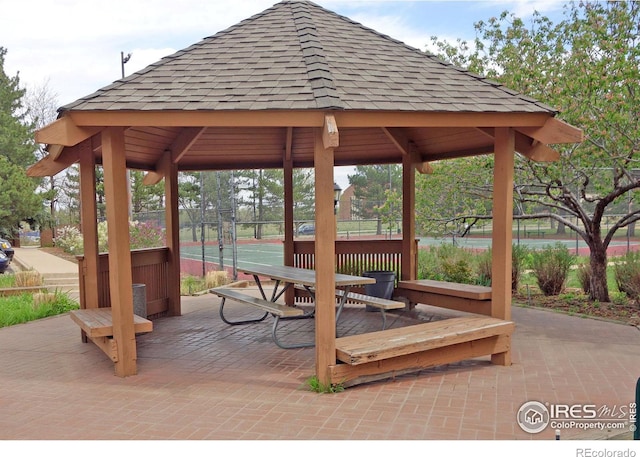 surrounding community featuring a gazebo and tennis court