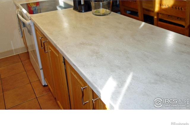 kitchen with light tile patterned flooring and white electric range oven