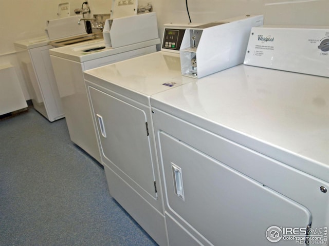 washroom with independent washer and dryer