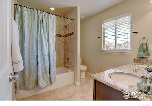 full bathroom with shower / tub combo with curtain, vanity, tile patterned floors, and toilet