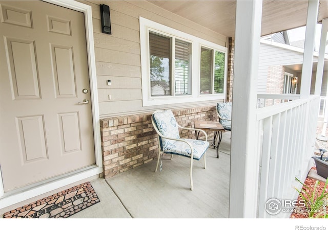 doorway to property featuring covered porch