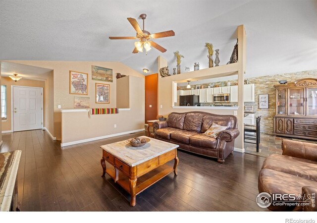 living room with vaulted ceiling, ceiling fan, and dark hardwood / wood-style flooring