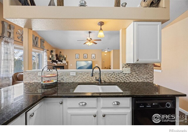 kitchen with sink, dishwasher, dark stone counters, decorative backsplash, and white cabinets