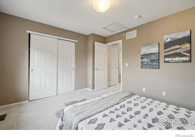 bedroom with light colored carpet and a closet