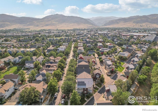 birds eye view of property with a mountain view