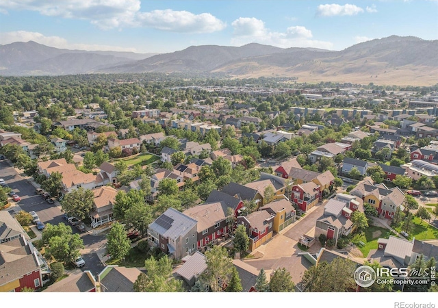 birds eye view of property with a mountain view