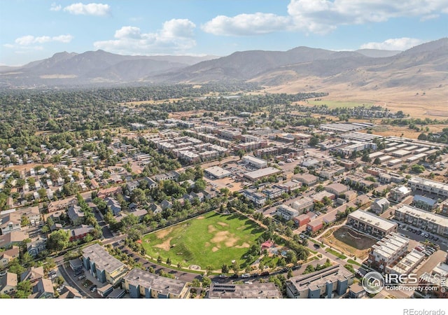 birds eye view of property with a mountain view