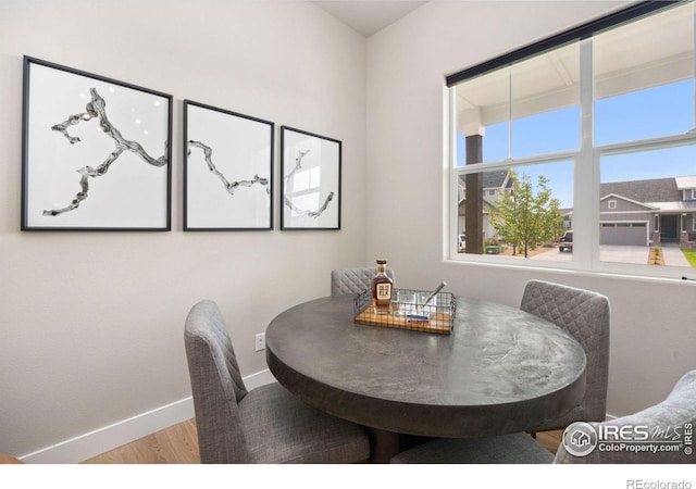 dining space with light hardwood / wood-style floors