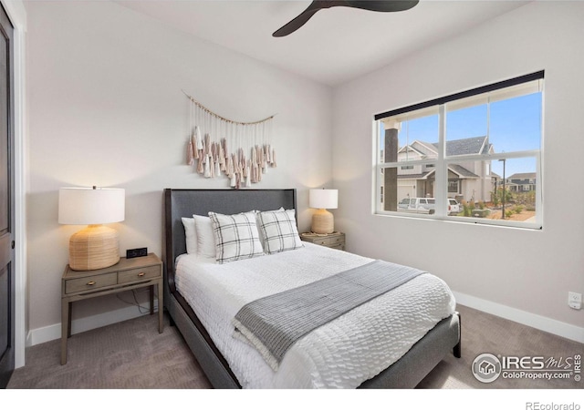 carpeted bedroom featuring ceiling fan