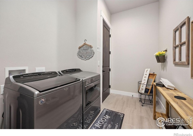 washroom featuring washing machine and clothes dryer