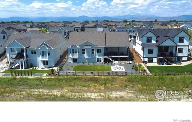 birds eye view of property with a mountain view