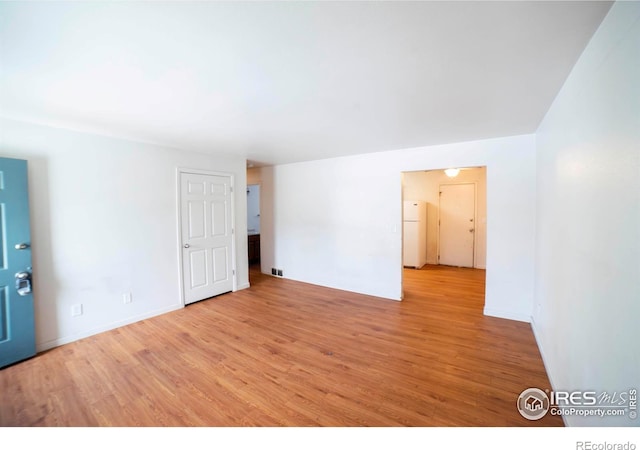 empty room featuring light wood-type flooring