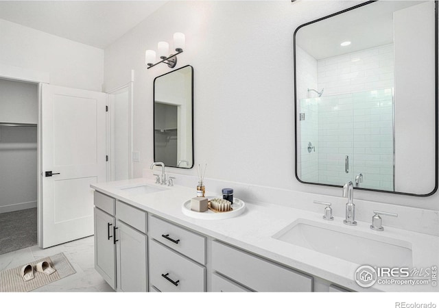 bathroom with an enclosed shower and vanity