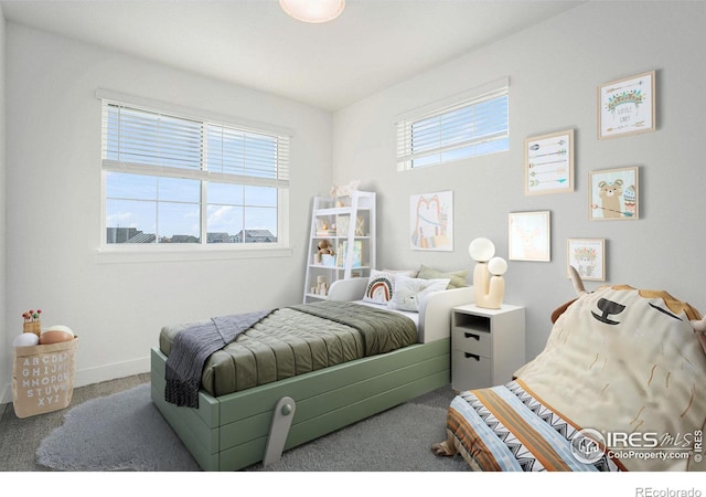 carpeted bedroom featuring multiple windows