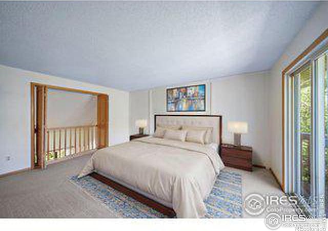 carpeted bedroom with a textured ceiling