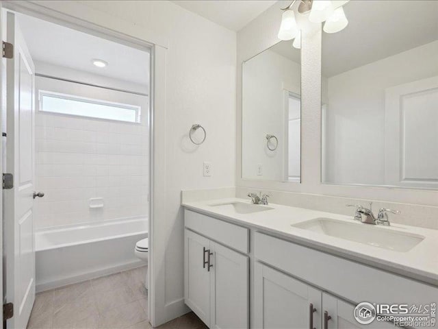 full bathroom featuring double vanity, toilet, and shower / tub combination