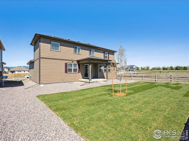 rear view of house with a patio