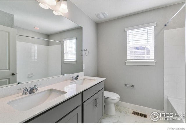 full bathroom with shower / bathtub combination, vanity, and toilet