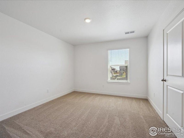 unfurnished room featuring light carpet, baseboards, and recessed lighting