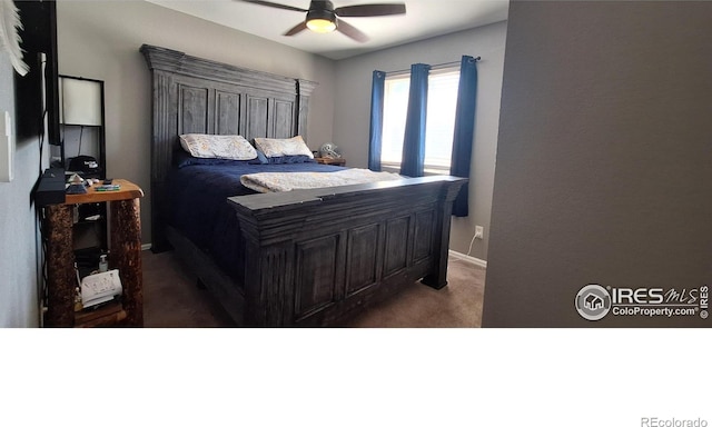 bedroom featuring dark carpet and ceiling fan